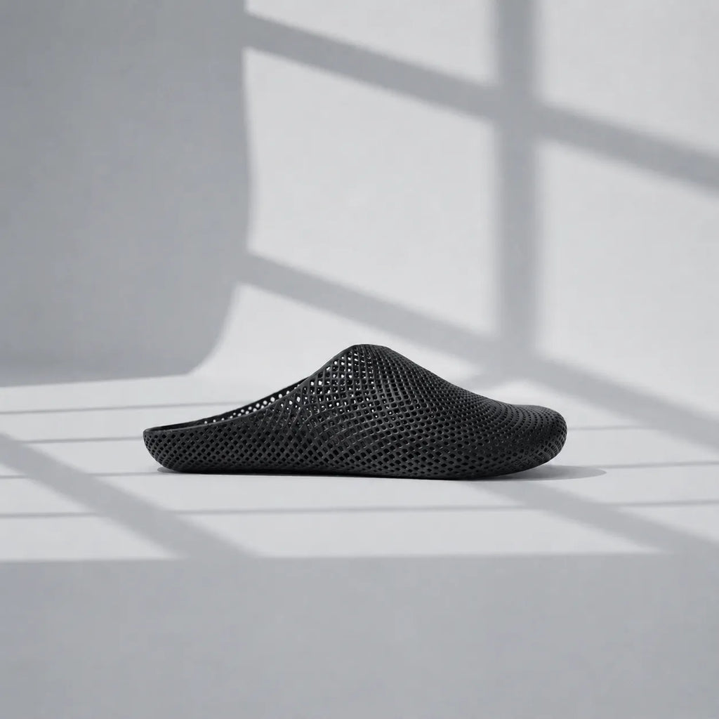 EASE 01 3D printed house slipper —  showing fine mesh lattice upper and minimal sole