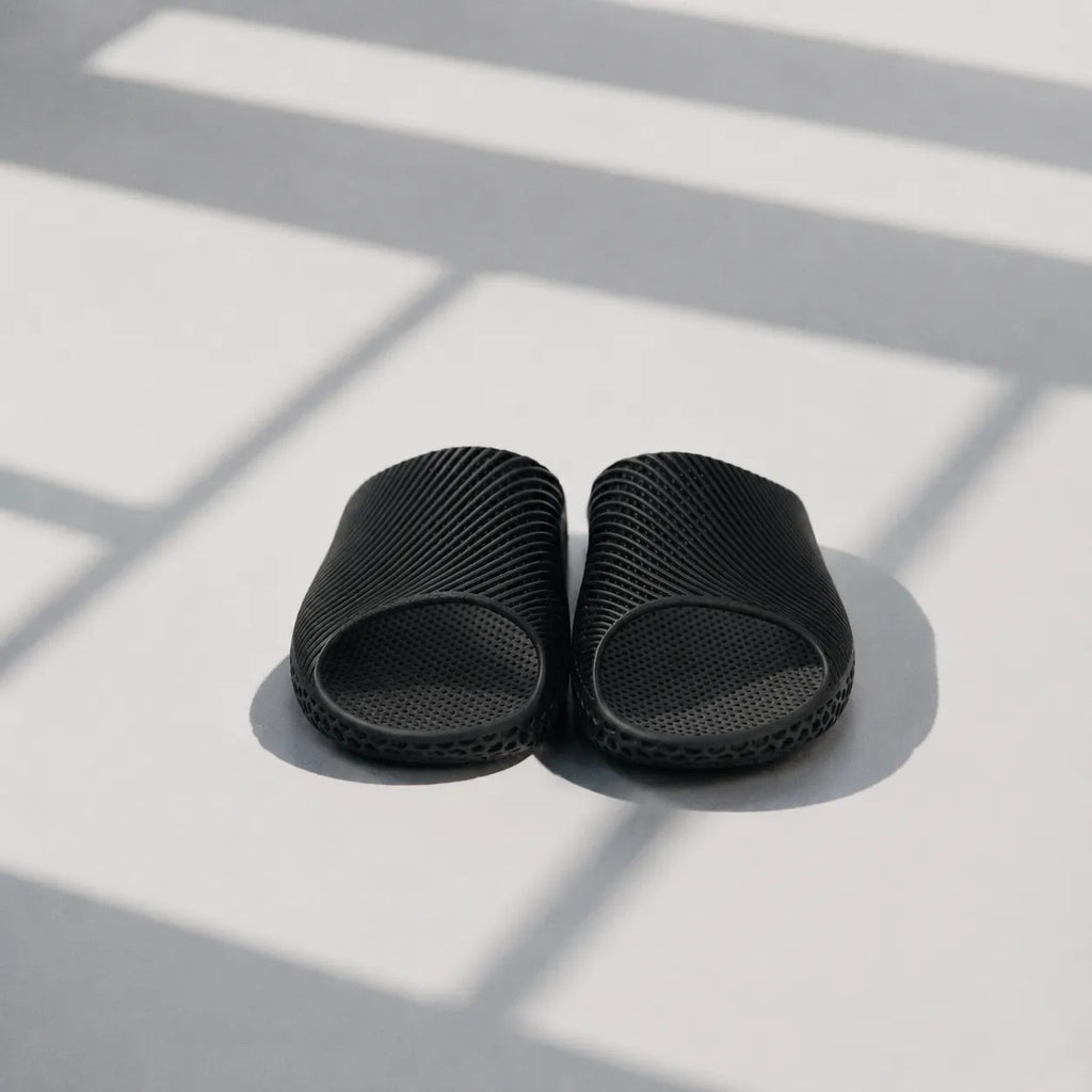 EASE 02 3D printed slide sandal — wave-textured upper and open honeycomb lattice sole