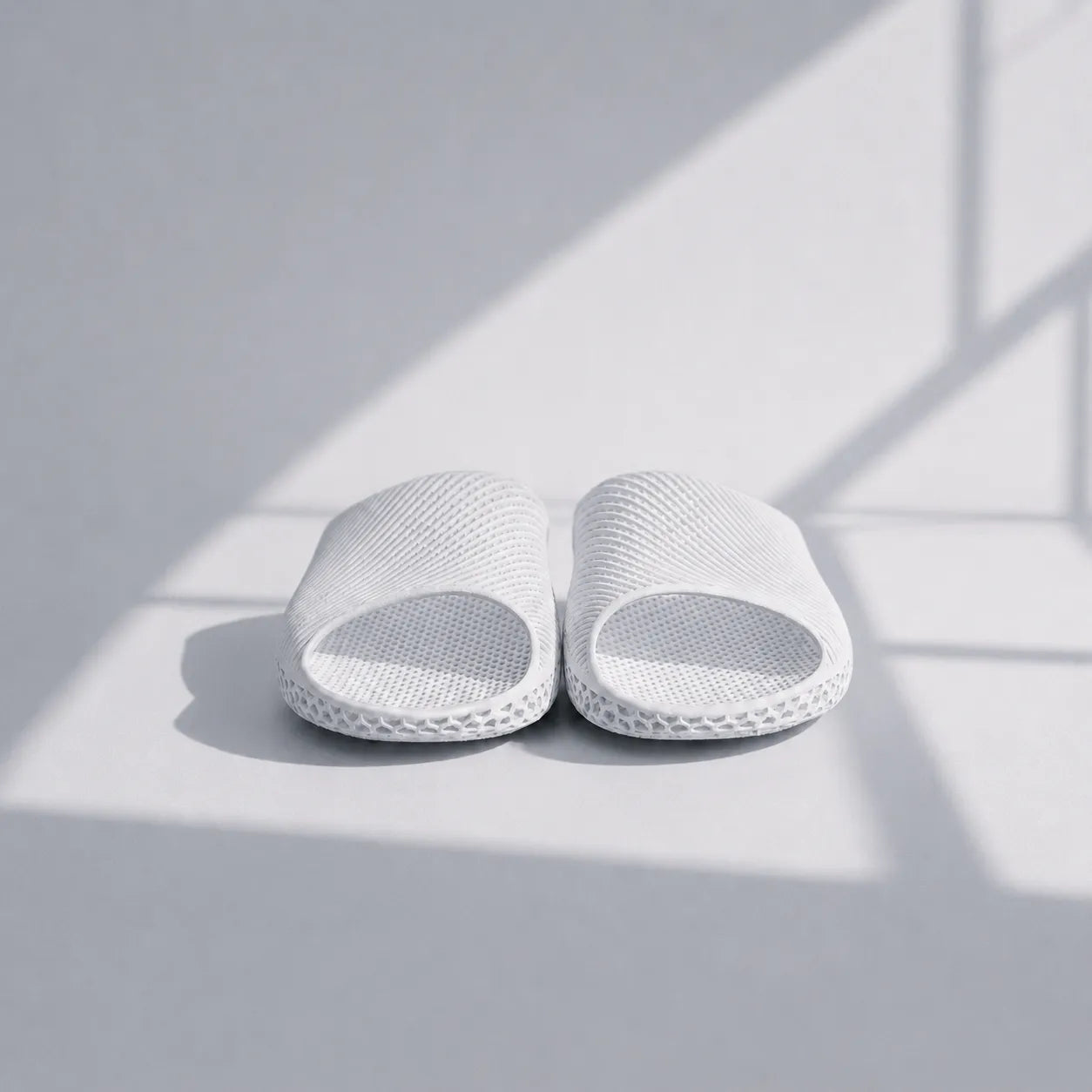 EASE 02 3D printed slide sandal — wave-textured upper and open honeycomb lattice sole