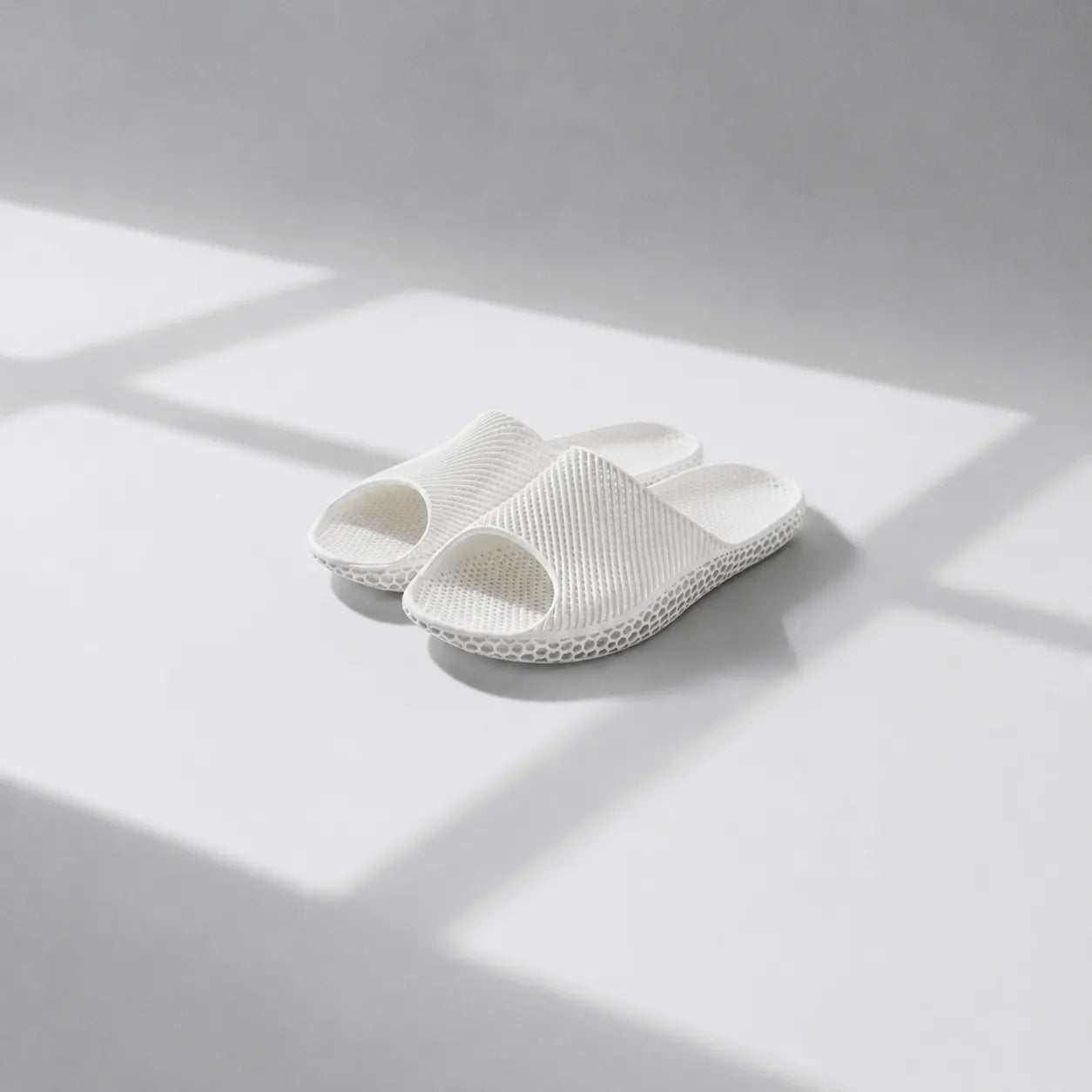 EASE 02 3D printed slide sandal — wave-textured upper and open honeycomb lattice sole