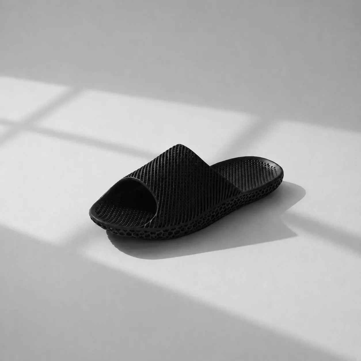 EASE 02 3D printed slide sandal — wave-textured upper and open honeycomb lattice sole