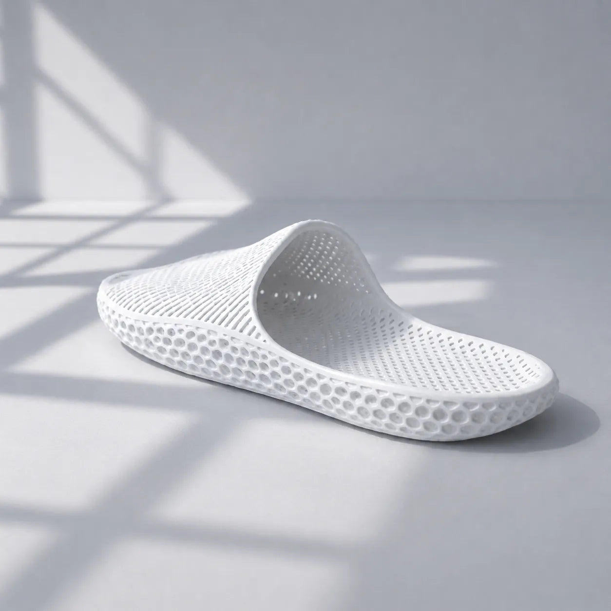 EASE 02 3D printed slide sandal — wave-textured upper and open honeycomb lattice sole