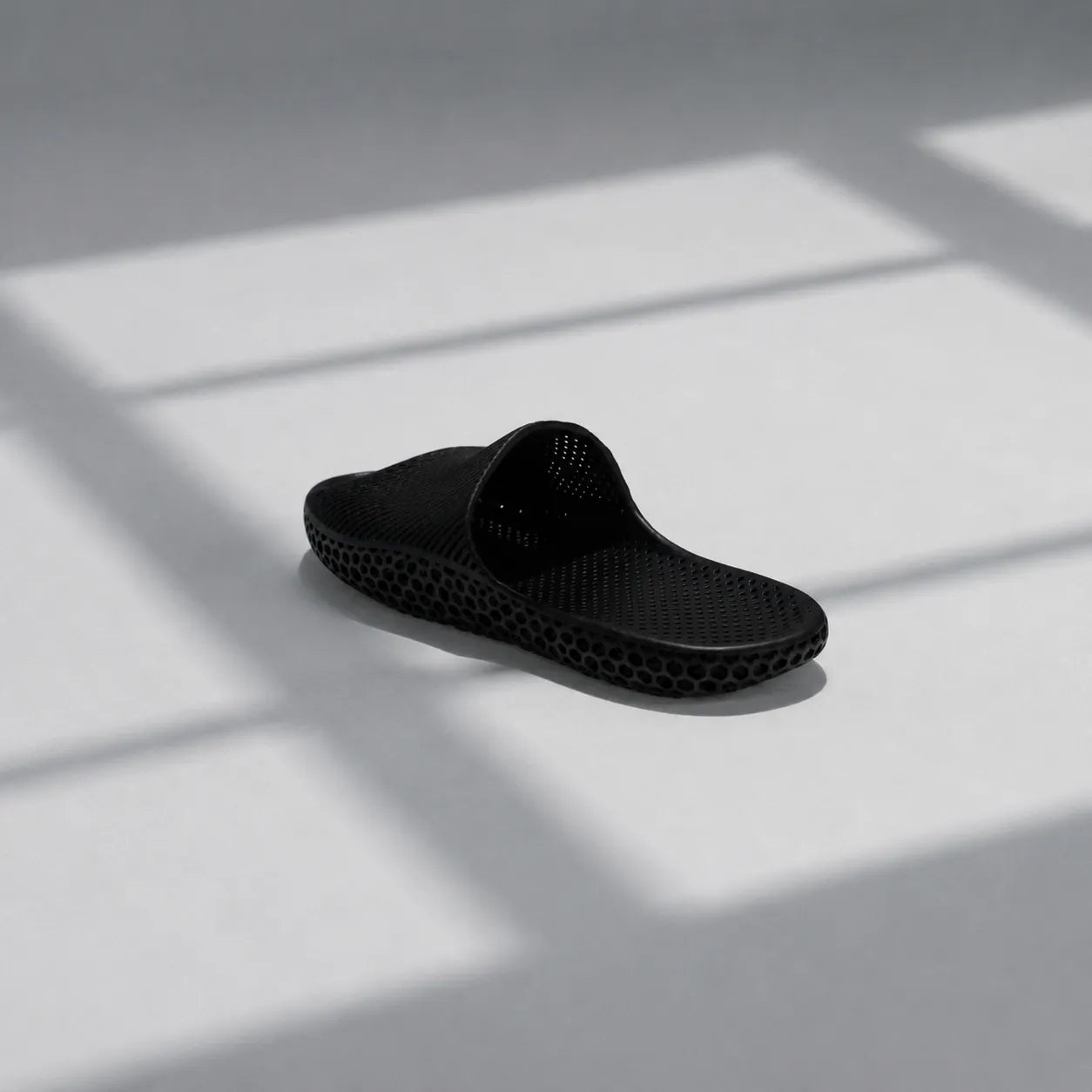 EASE 02 3D printed slide sandal — wave-textured upper and open honeycomb lattice sole