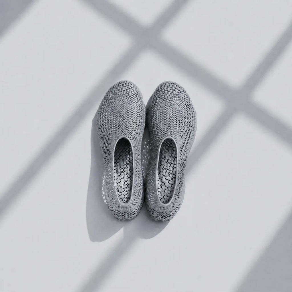 EXTRALOGIA FORM02 3D printed shoe pair — showing triangulated open-lattice structure