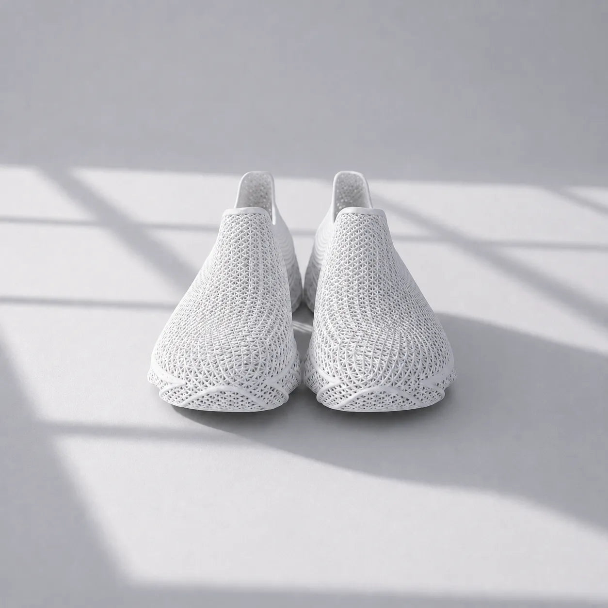 EXTRALOGIA FORM02 3D printed shoe pair — showing triangulated open-lattice structure