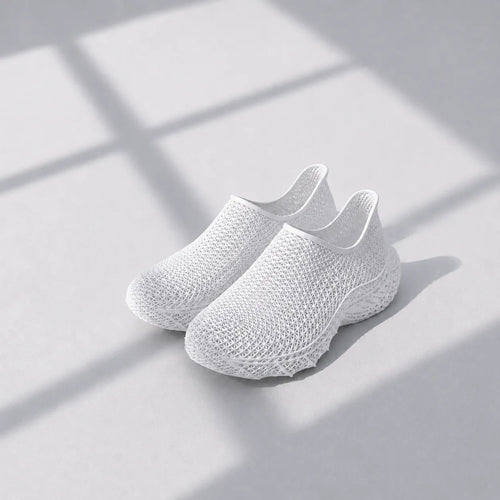 EXTRALOGIA FORM02 3D printed shoe pair — showing triangulated open-lattice structure