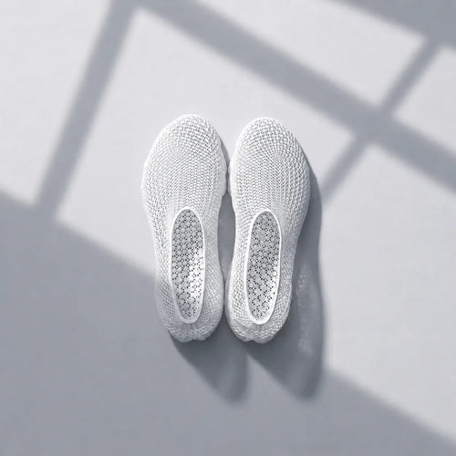 EXTRALOGIA FORM02 3D printed shoe pair — showing triangulated open-lattice structure